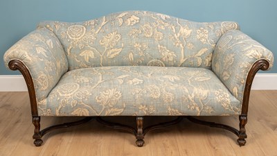 Lot 284 - A blue and white floral upholstered sofa on...