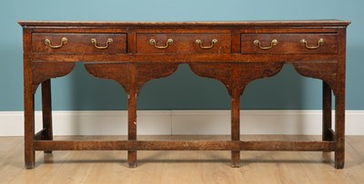 Lot 347 - An oak dresser base, with three drawers with...