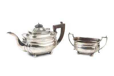 Lot 624 - A George V silver teapot, and matching twin...