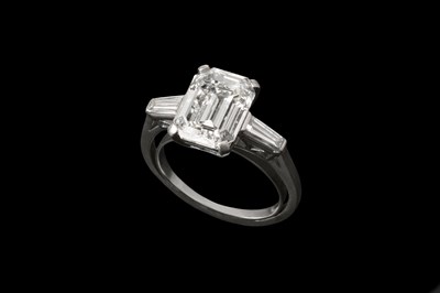 Lot 148 - A diamond single stone ring, the emerald-cut...