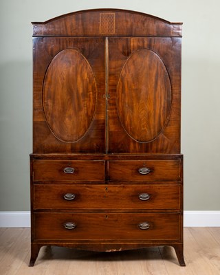 Lot 199 - A Regency mahogany linen press with arching...