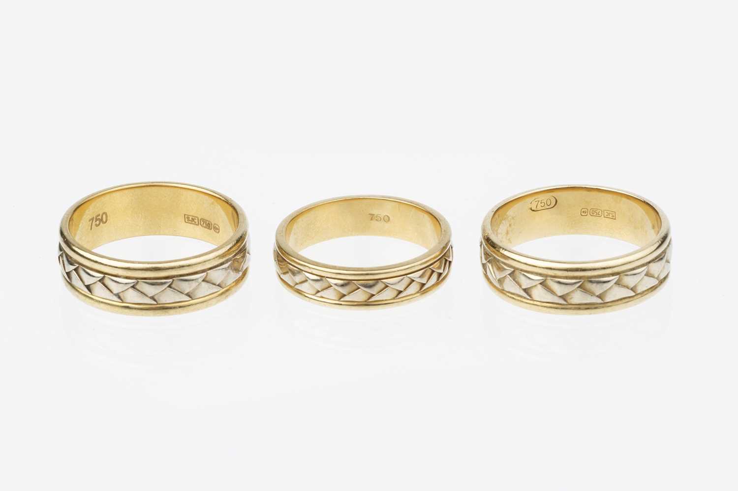 Lot 51 Three 18ct gold dress rings, each designed as