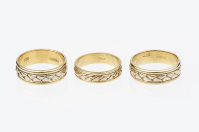 Lot 51 - Three 18ct gold dress rings, each designed as...