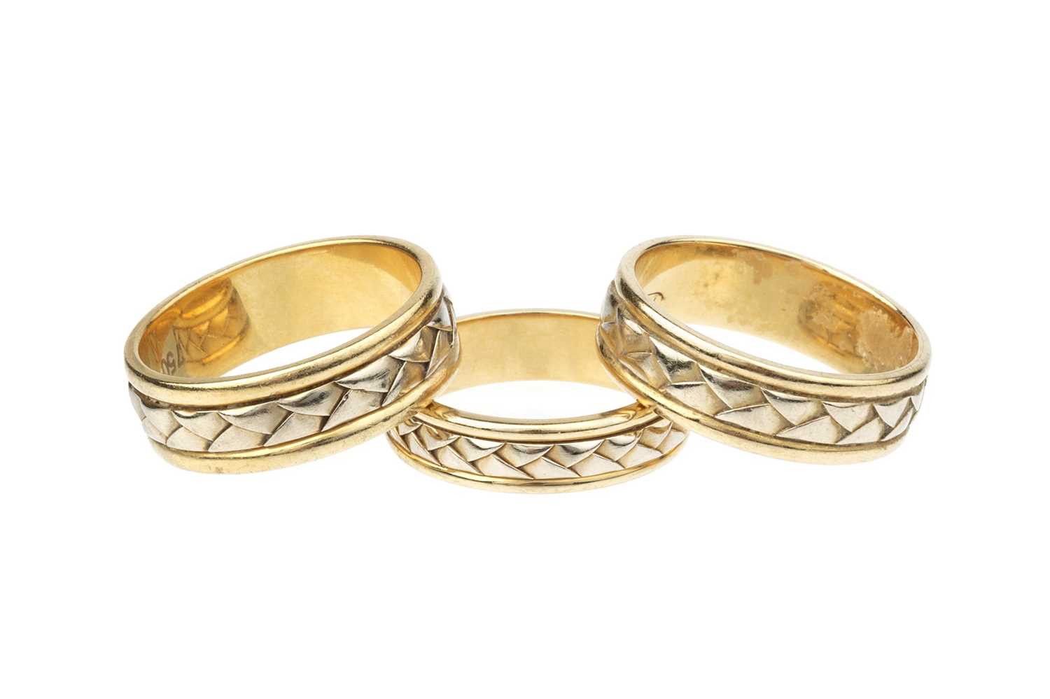 Lot 51 - Three 18ct gold dress rings, each designed as...