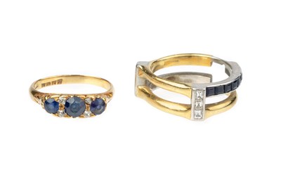 Lot 94 - A sapphire and diamond half hoop ring, the...