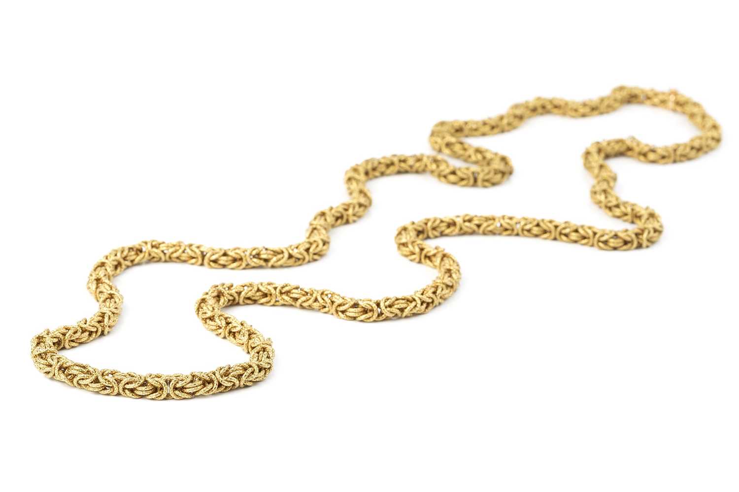 Lot 5 - A yellow precious metal fancy-link long chain...