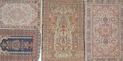 Lot 1051 - An Indian blue and red ground part silk rug