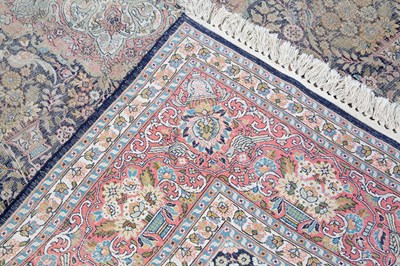 Lot 1051 - An Indian blue and red ground part silk rug