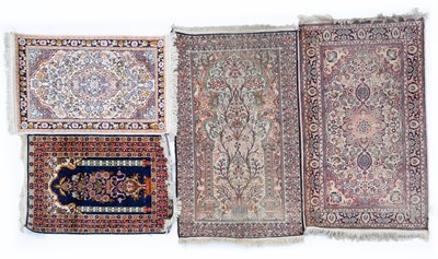 Lot 1051 - An Indian blue and red ground part silk rug