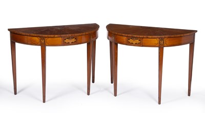 Lot 180 - A pair of George III style satinwood demi lune...