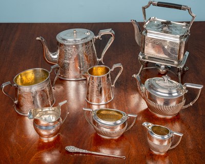 Lot 75 - A silver three-piece tea set, a Georgian cream...