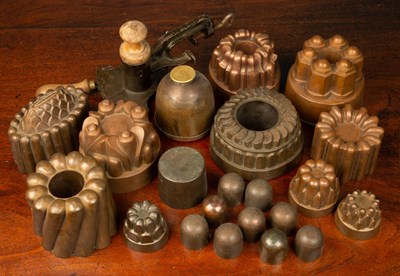 Lot 326 - Twenty copper jelly moulds of various sizes,...