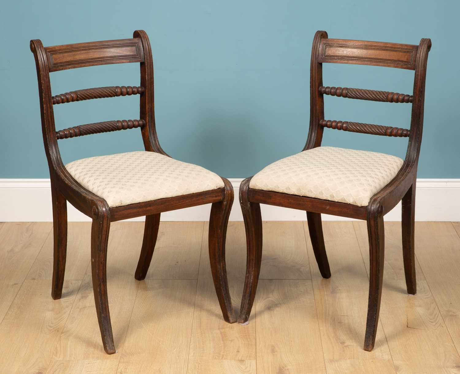 Lot 195 - A pair of Regency mahogany dining chairs with...