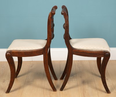 Lot 195 - A pair of Regency mahogany dining chairs with...