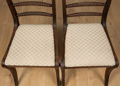 Lot 195 - A pair of Regency mahogany dining chairs with...