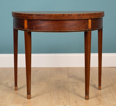 Lot 479 - A George III mahogany D-shaped foldover card table