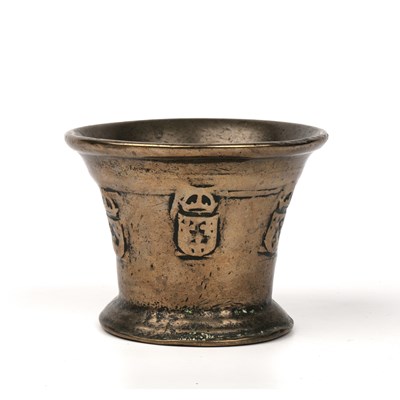 Lot 297 - A 17th century bronze mortar with raised...