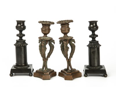 Lot 312 - A pair of Regency bronze candlesticks on...