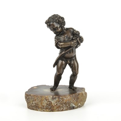 Lot 319 - An 18th century bronze cherub with a small dog...