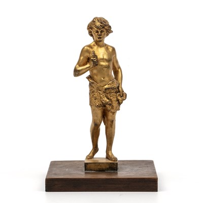 Lot 348 - A gilt bronze model of a boy on a wooden stand,...