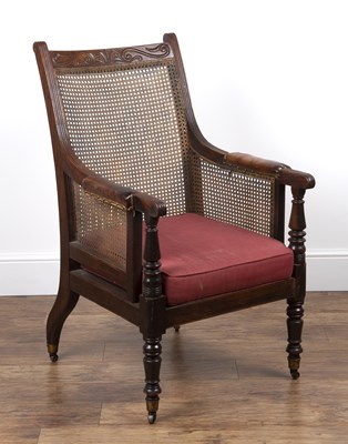 Lot 101 - Mahogany Bergere library chair 19th Century,...