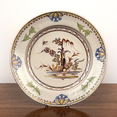 Lot 295 - Lambeth delftware charger painted with a...