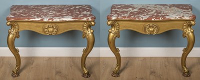 Lot 115 - A pair of antique carved and gilt oak console tables