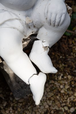 Lot 324 - Three white composite stone cherub sculptures