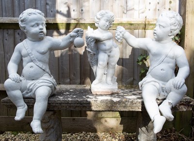 Lot 324 - Three white composite stone cherub sculptures