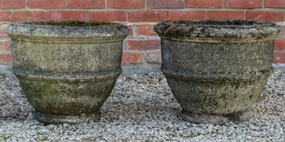 Lot 1092 - A pair of cast reconstituted stone garden urns