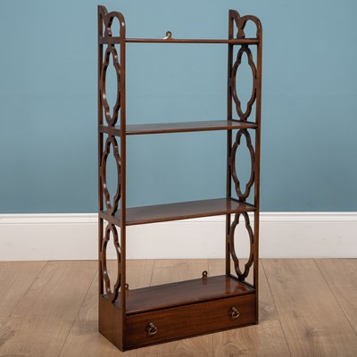 Lot 307 - A hanging bookshelf, mahogany, with three...