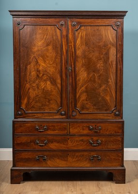 Lot 114 - A George III and later mahogany linen press