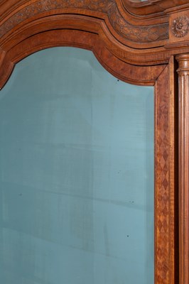 Lot 110 - A late 19th or early 20th century walnut armoire in the neoclassical style