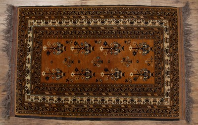 Lot 115 - Red ground rug Afghanistan, with elephant foot...