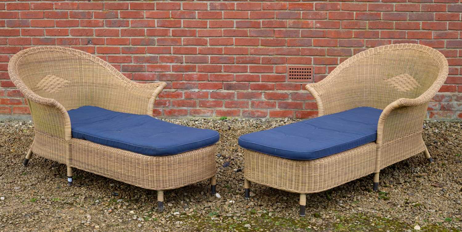 Lot 1081 - A pair of wicker effect sun loungers