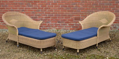 Lot 1081 - A pair of wicker effect sun loungers