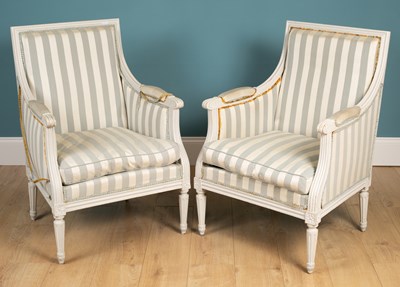 Lot 496 - A pair of French white painted armchairs