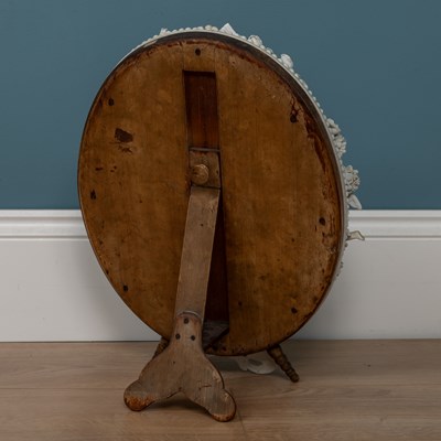 Lot 543 - A Dresden porcelain framed oval mirror on an adjustable tripod stand
