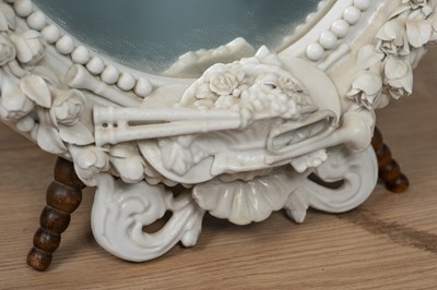 Lot 543 - A Dresden porcelain framed oval mirror on an adjustable tripod stand