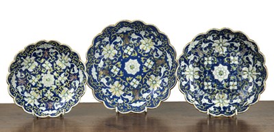 Lot 155 - Three graduated blue enamelled bowls Chinese,...