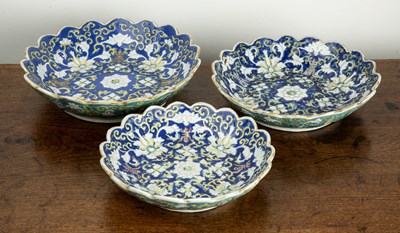 Lot 155 - Three graduated blue enamelled bowls Chinese,...