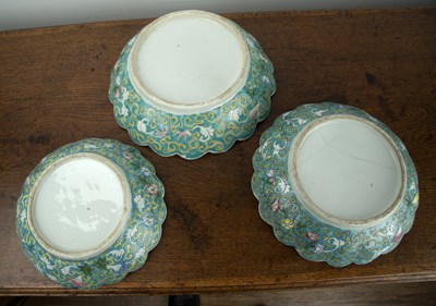 Lot 155 - Three graduated blue enamelled bowls Chinese,...