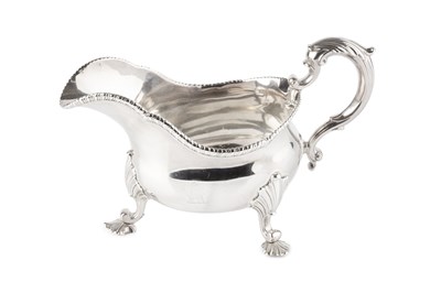 Lot 637 - An early George III silver sauce boat, with...