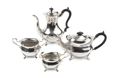 Lot 657 - A George V silver four piece tea and coffee...