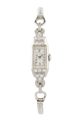 Lot 119 - A diamond set cocktail watch by Longines, the...