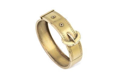 Lot 29 - A Victorian gold bangle, of hinged oval form...