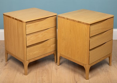 Lot 205 - A pair of Ercol Rimini bedside chests, oak,...