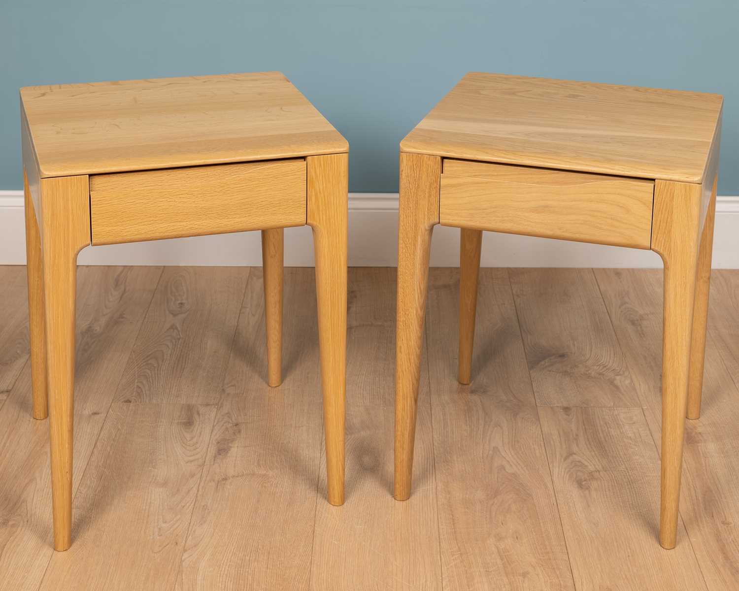 Lot 208 A pair of Ercol Rimini bedside tables with
