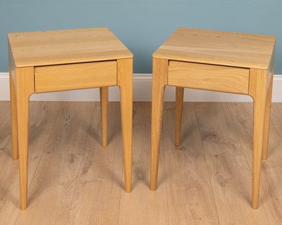 Lot 208 - A pair of Ercol Rimini bedside tables, with...