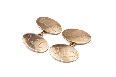 Lot 99 - A pair of 9ct gold cufflinks, with oval panels...